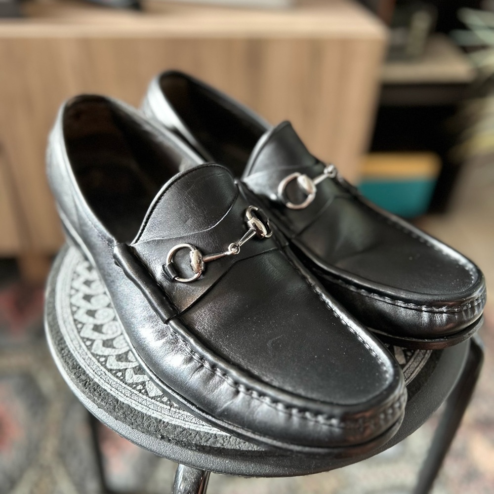 Size 13 black leather Gucci loafers.